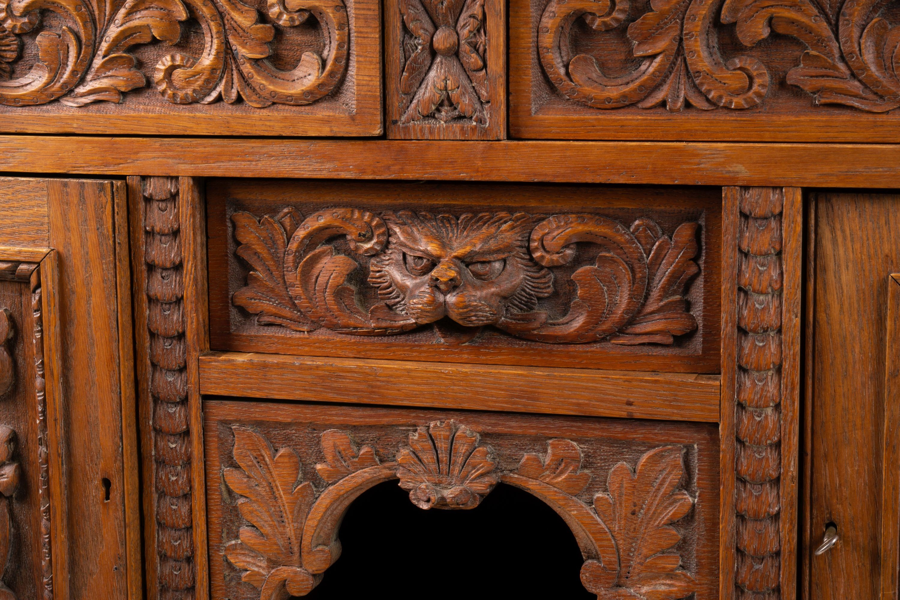 A late 19th century Flemish carved oak buffet, length 158cm, depth 58cm, height 99cm